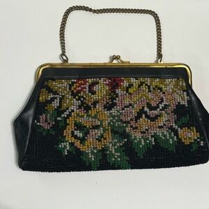 Vintage needlepoint tapestry clutch with floral design and gold tone metal frame
